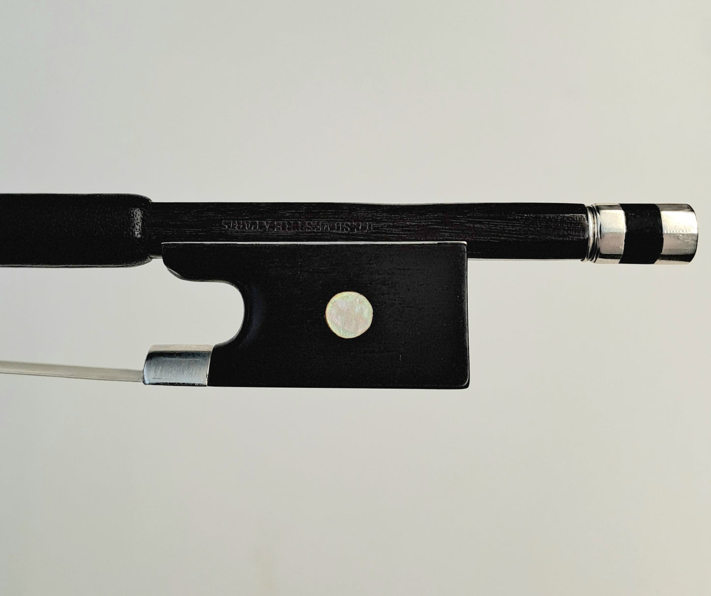 A Silver-Mounted French Violin Bow by Auguste Barbé, circa 1890, stamped 'H.C.Silvestre à Paris'