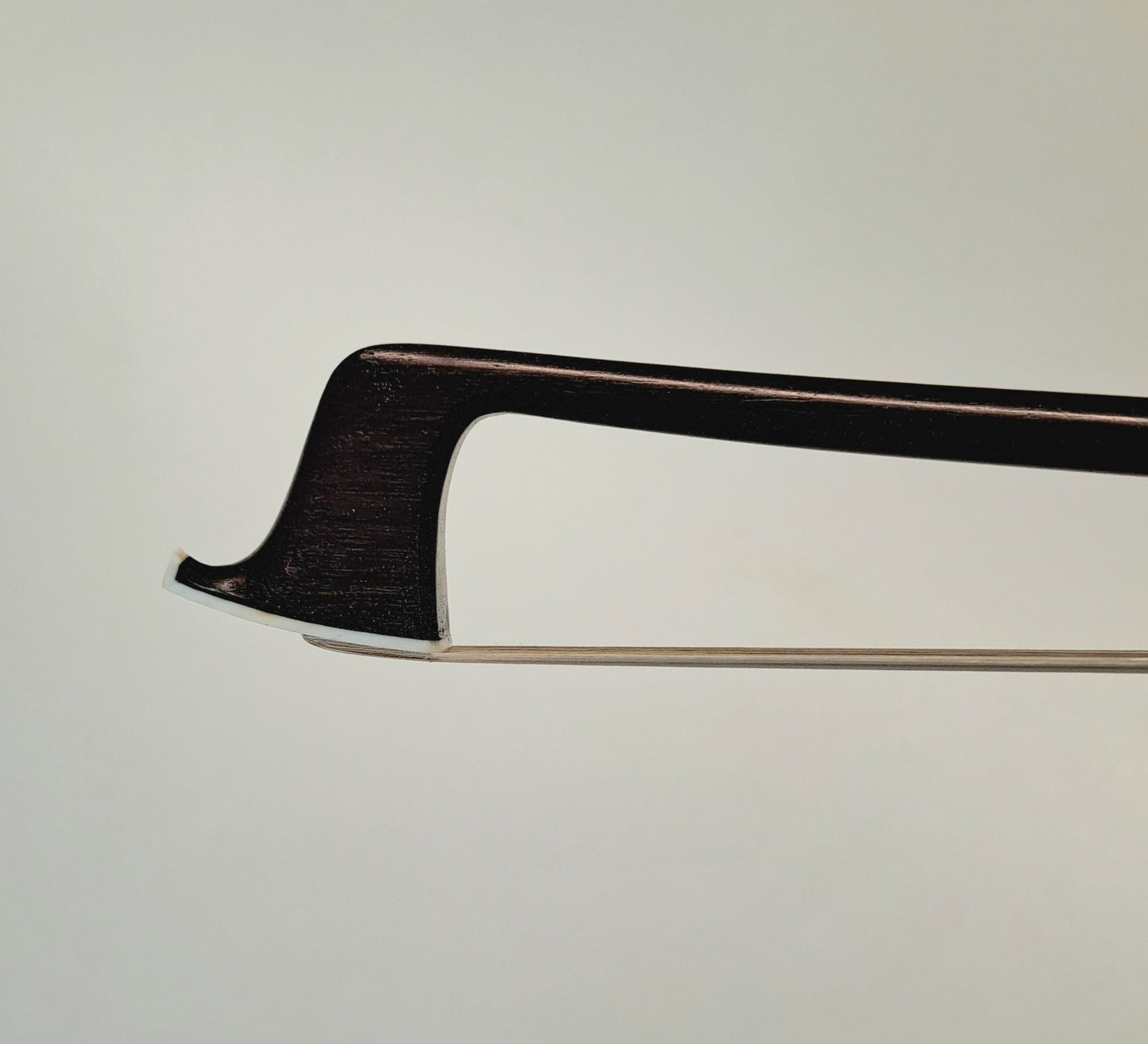 A Silver-Mounted French Violin Bow by Auguste Barbé, circa 1890, stamped 'H.C.Silvestre à Paris'