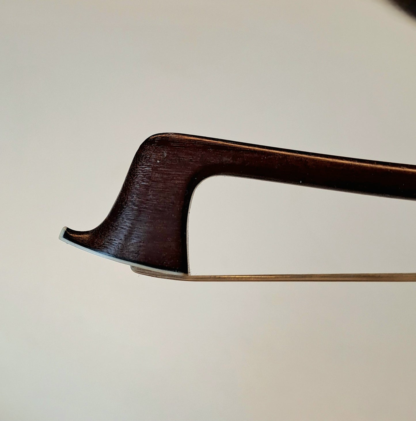 A Silver-Mounted French Violin Bow by Pierre Husson, for George Withers & Sons of London